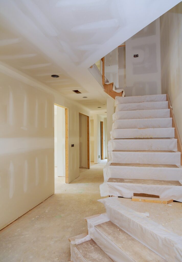 New home interior construction of housing with drywall installed